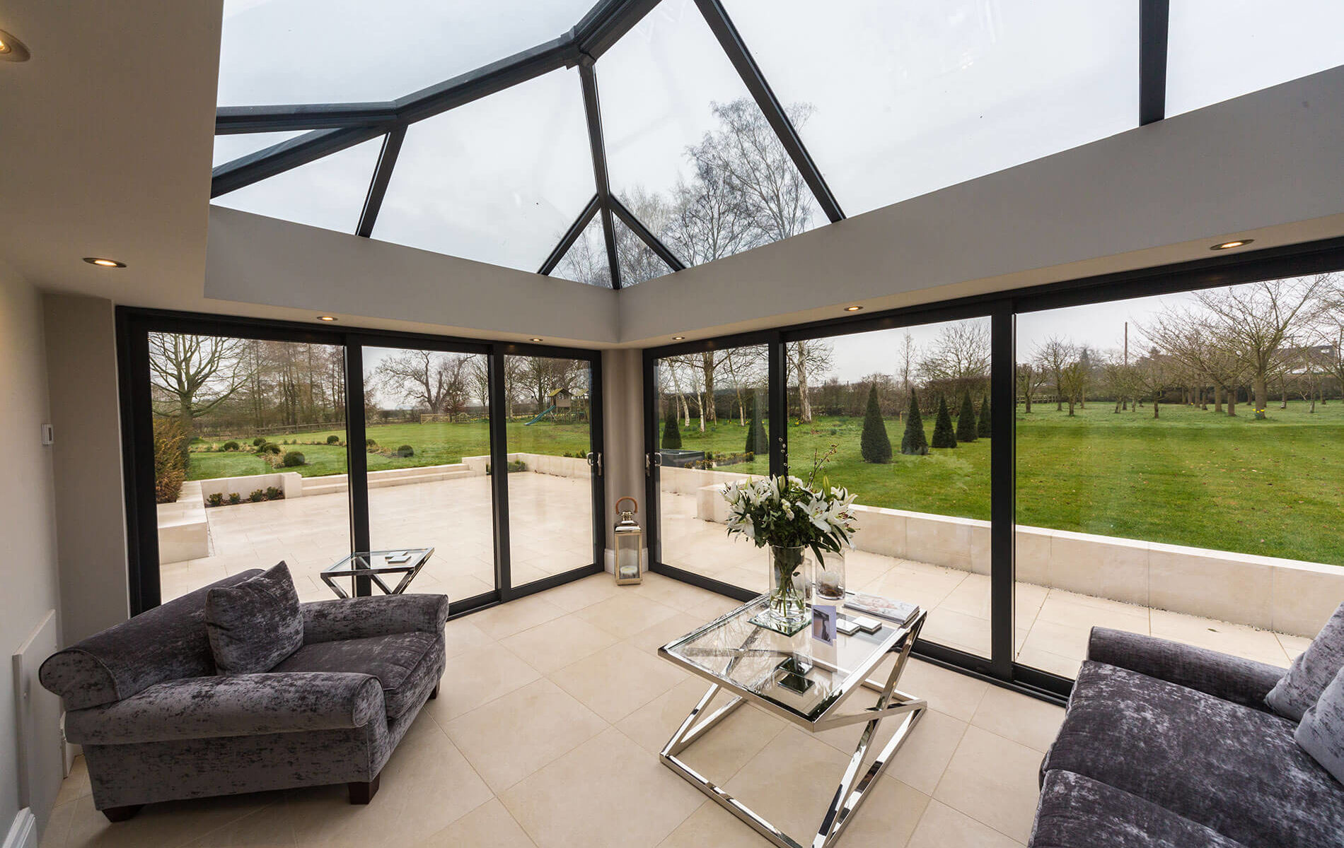 A clear conservatory with a roof lantern in Edenbridge