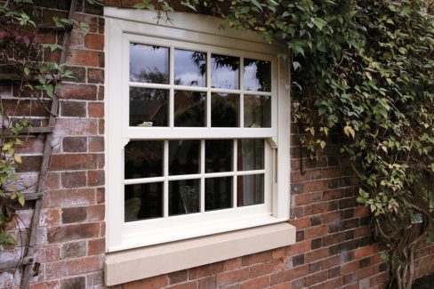 White sliding sash windows from a brick house in Shooters Hill.