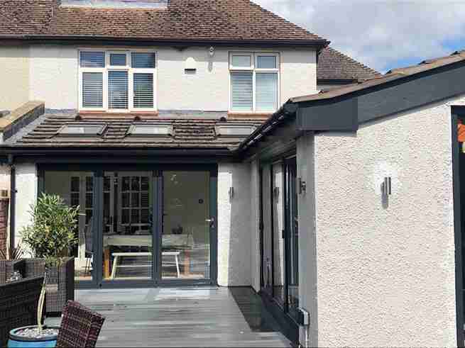 Navy blue Origin aluminium bifold doors.